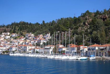 Famous main picturesque village of Poros island featuring clock tower, Saronic Gulf, Greece